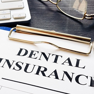 Dental insurance paperwork on desk