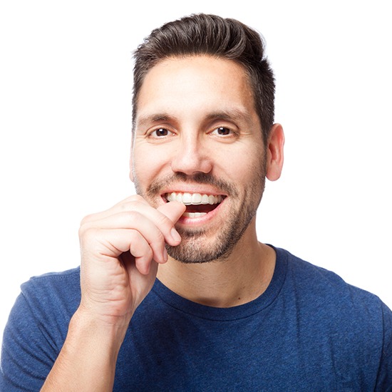 Man placing an Invisalign tray