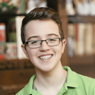 Smiling teen boy with traditional braces