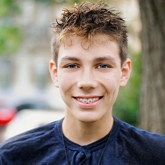 Teen boy with braces smiling