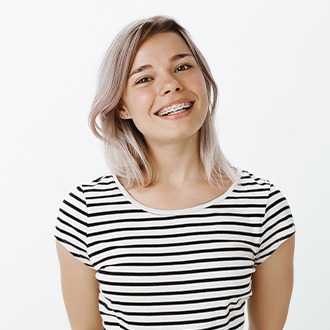 Young woman with braces smiling