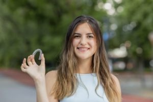 smiling woman with adult braces in Dayville