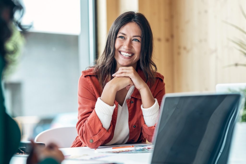 Businesswoman smiling in meeting